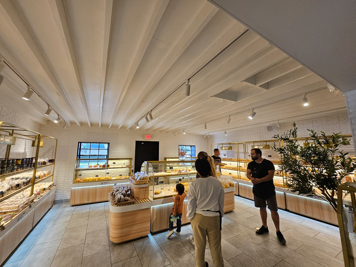 open white room with shelves of pastries